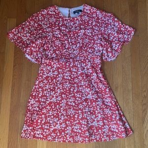 Red and white floral dress with float sleeves and partially opened back